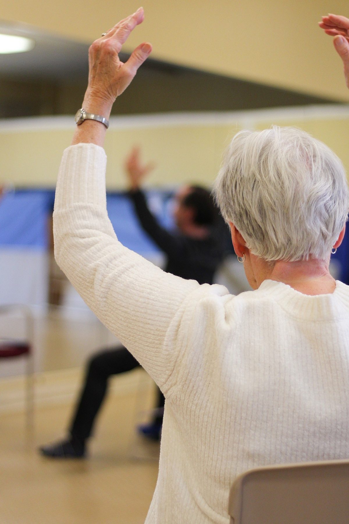 woman stretching arms above head
